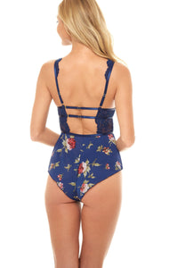 Oh La La Cheri Floral Print Empire Waist Romper With Deep V Neckline in Blue